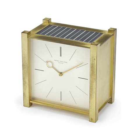 Sold Price: Patek Phillipe: A gilt brass solar powered square clock 